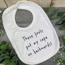 Load image into Gallery viewer, These Fools Put My Cape On Backwards Baby Bib
